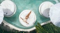 Woman relaxing in clear pool water in hot sunny day on Bali villa