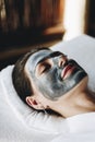 Woman relaxing with a facial mask at the spa Royalty Free Stock Photo