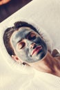 Woman relaxing with a facial mask at the spa Royalty Free Stock Photo