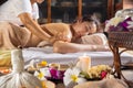 Woman relaxing while get oil massage at thai traditional spa salon Royalty Free Stock Photo