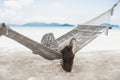 Woman relaxing in the hammock in tropical beach on summer vacation. Royalty Free Stock Photo