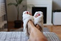 Ultimate Relaxation: Resting Feet in Puffy White Slippers Royalty Free Stock Photo