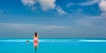 Woman in infinity swimming pool at Maldives Royalty Free Stock Photo