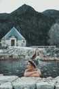 Woman relaxing inside a natural pool thermal hot volcanic water in beautiful country side mountain scenic place. Alternative Royalty Free Stock Photo