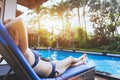 Woman relaxing in luxury tropical resort hotel near swimming pool Royalty Free Stock Photo