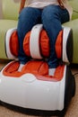 Woman relaxing in massage armchair