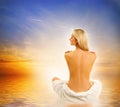 Woman relaxing near the sea Royalty Free Stock Photo