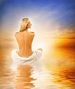 Woman relaxing near the sea Royalty Free Stock Photo