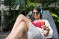 woman relaxing near swimming pool Royalty Free Stock Photo