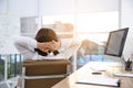 Woman relaxing in office chair at workplace, back view Royalty Free Stock Photo