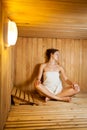 Woman relaxing in a sauna