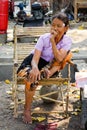 A woman relaxing on street at Chinatown in Yangon, Myanmar