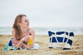 Woman relaxing and sunbathing on beach Royalty Free Stock Photo