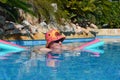 Woman relaxing in swimming pool in summer Royalty Free Stock Photo