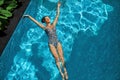 Woman Relaxing In Swimming Pool Water. Summer Holidays Vacation. Royalty Free Stock Photo