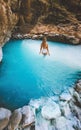 Woman relaxing in a thermal bath outdoor travel in Albania, Benja hot springs girl swimming in natural pool Royalty Free Stock Photo