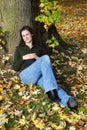 Woman relaxing under a tree Royalty Free Stock Photo