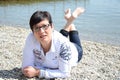 Woman relaxing at the waterfront at lake chiemsee