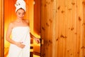 Woman relaxing in wooden sauna room Royalty Free Stock Photo