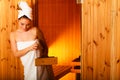 Woman relaxing in wooden sauna room Royalty Free Stock Photo