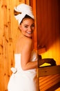 Woman relaxing in wooden sauna room Royalty Free Stock Photo