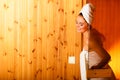 Woman relaxing in wooden sauna room Royalty Free Stock Photo