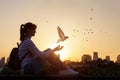 Woman releases a dove and prays