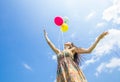 Woman releasing balloons Royalty Free Stock Photo
