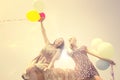 Woman releasing balloons Royalty Free Stock Photo