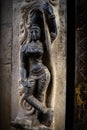 Woman religious figure sculpture on the wall of Marudhamalai temple, India, Vertical