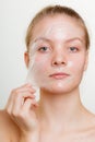 Woman removing facial peel off mask. Royalty Free Stock Photo