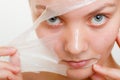 Woman removing facial peel off mask closeup Royalty Free Stock Photo