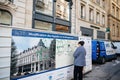 Woman Removing Graffiti in Urban France