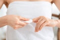 Woman removing lacquer from manicured nails with white cotton pad Royalty Free Stock Photo