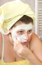 Woman removing mask Royalty Free Stock Photo