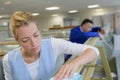 Woman removing stain from frame