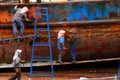 Woman repair old ship