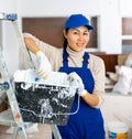 Woman repair worker inside apartment Royalty Free Stock Photo