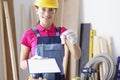 Woman repairer with documents and keys Royalty Free Stock Photo