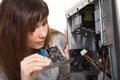 Woman repairing the computer Royalty Free Stock Photo