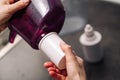 Woman replacing filter in a water pitcher. Female hand removes an old tap water purification cartridge from a jug. Royalty Free Stock Photo