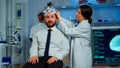 Woman researcher putting brainwave scanning headset