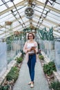 Woman researcher standing in greenhouse, using tablet. Royalty Free Stock Photo