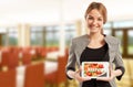 Woman restaurant manager holding tablet with menu