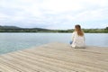 Woman resting contemplating views in a lake Royalty Free Stock Photo