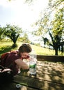 Woman resting during hiking drinking mineral water Royalty Free Stock Photo