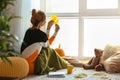 Woman resting at home on autumn day