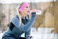 Woman resting from jogging or sport on winter day Royalty Free Stock Photo