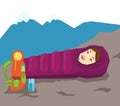 Woman resting in sleeping bag in the mountains.