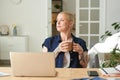 Woman resting after work with cup of coffee Royalty Free Stock Photo